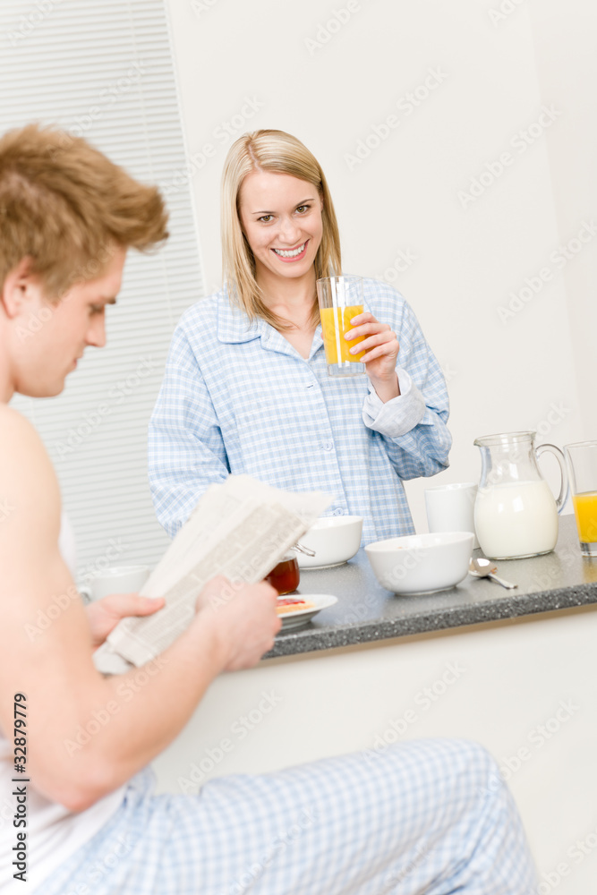 Breakfast happy couple eat cereal drink juice Breakfast happy couple eat cereal drink juice