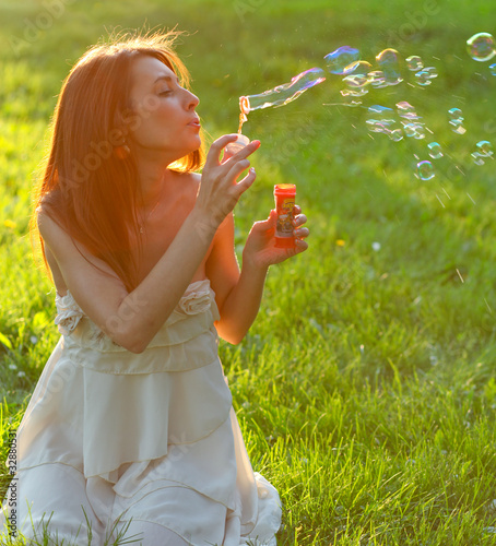 attractive young girl with soap-bubbles