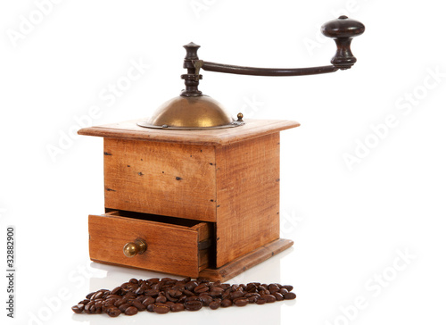 Old wooden coffee grinder over white background