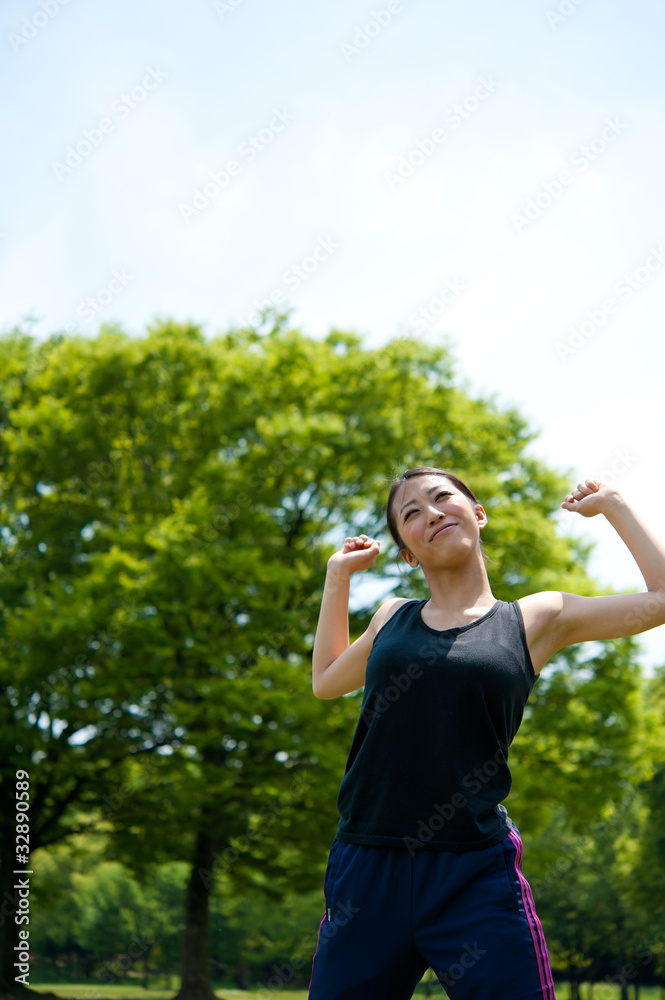 beautiful asian woman relaxing in the park