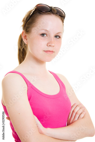 Teen in sunglasses on white background. © Sergey Khamidulin