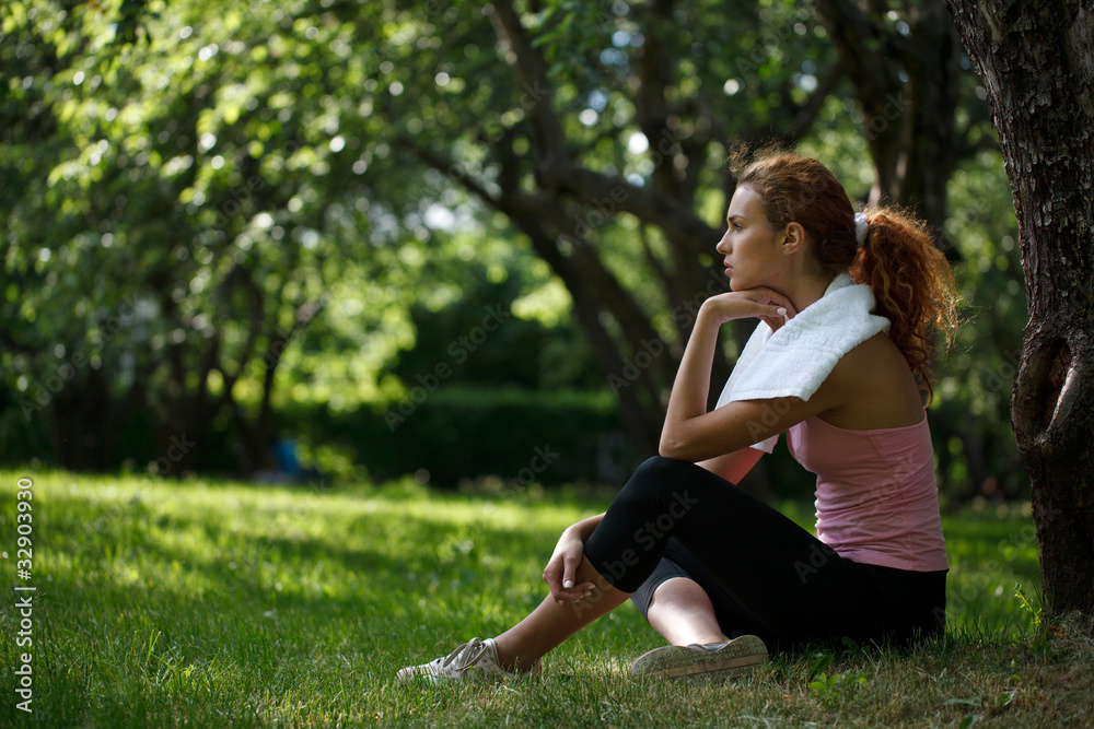 Woman sitting on grass