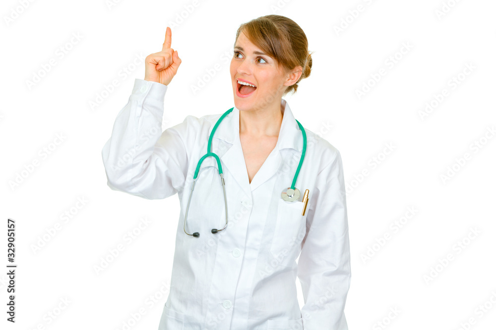 Surprised medical doctor woman with rised finger. Idea gesture. Surprised medical doctor woman with rised finger. Idea gesture.