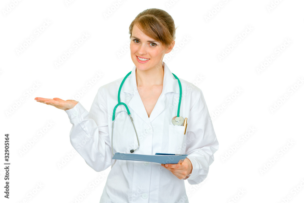 Smiling doctor woman with chart presenting something on hand Smiling doctor woman with chart presenting something on hand