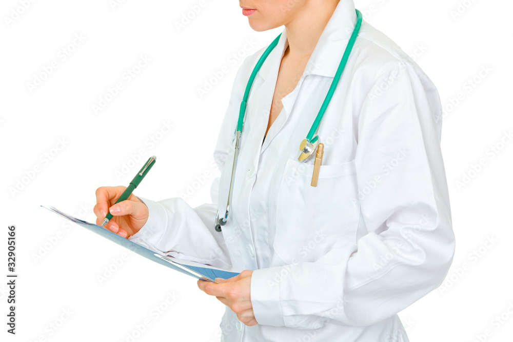 Medical female doctor making notes in document. Close-up. Medical female doctor making notes in document. Close-up.