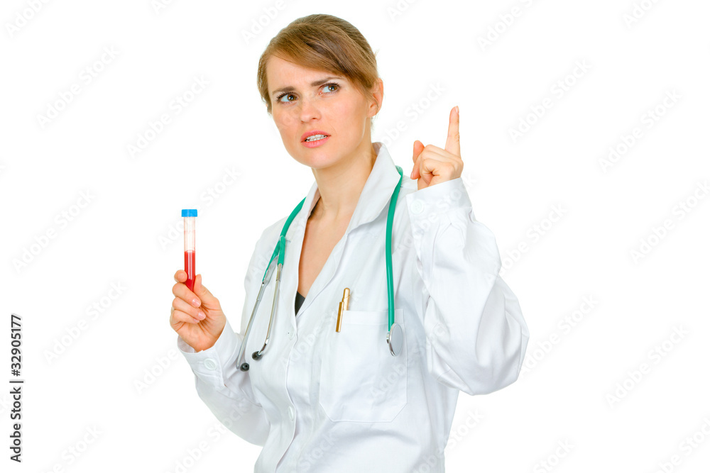 Medical doctor woman with rised finger holding test tubes Medical doctor woman with rised finger holding test tubes