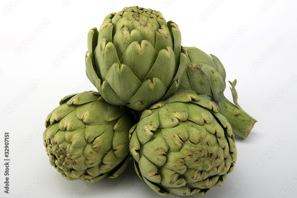 Raw artichokes in a pile Raw artichokes in a pile