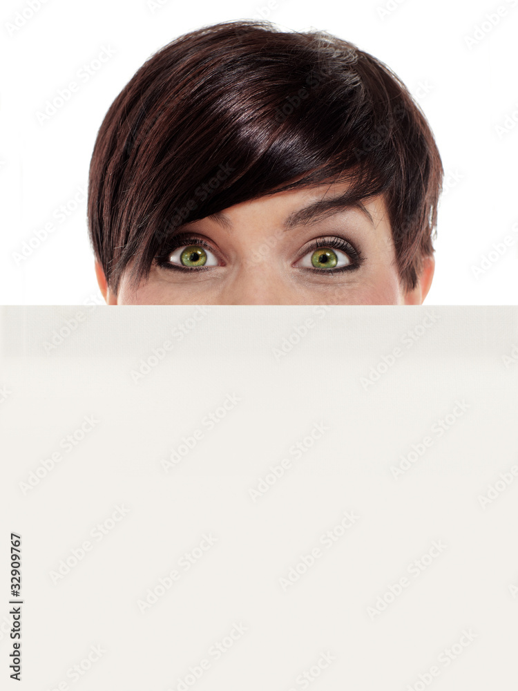 Female looking squarely into your eyes and over a board Female looking squarely into your eyes and over a board