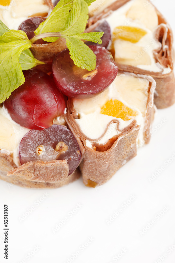 Tiramisu Sushi Roll garnished with Grapes and Mint Tiramisu Sushi Roll garnished with Grapes and Mint