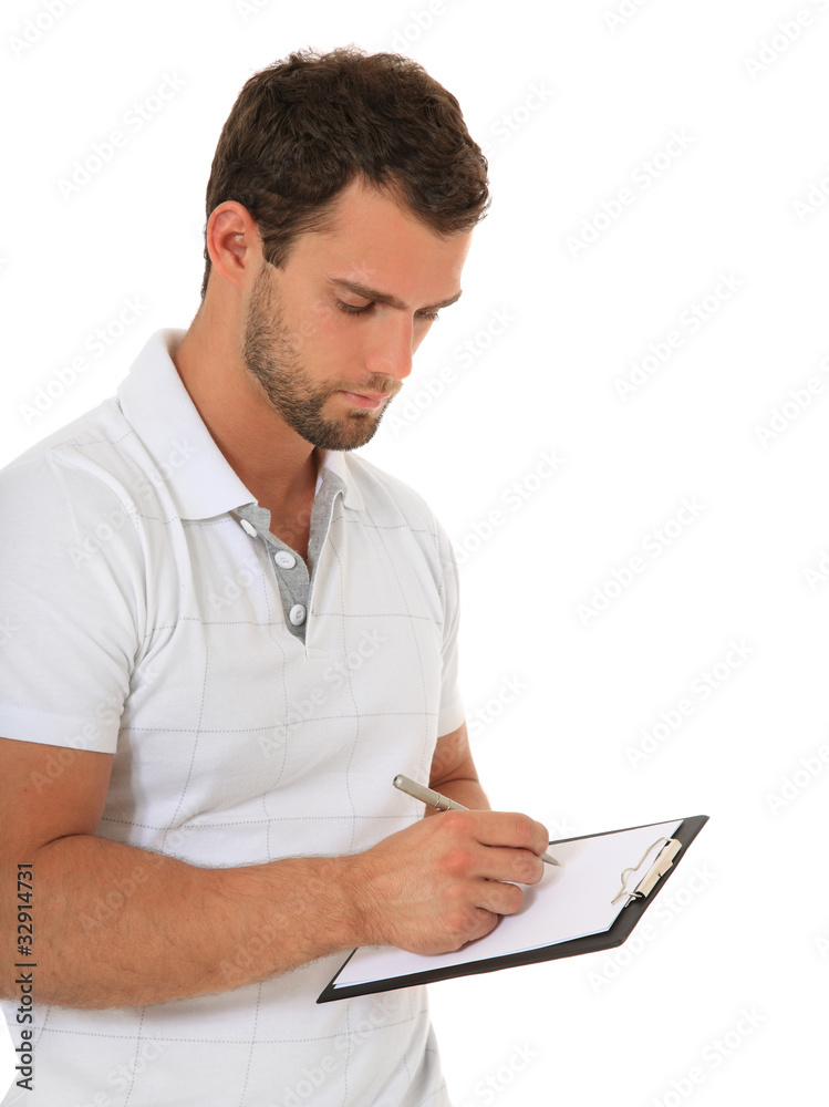 Fitnesstrainer notiert Trainingsplan Fitnesstrainer notiert Trainingsplan