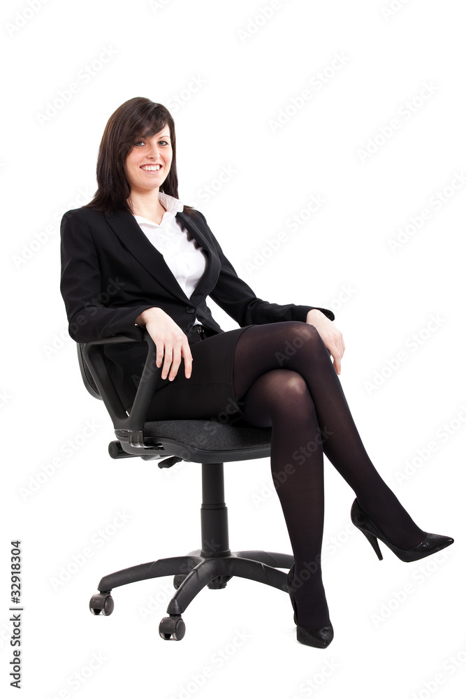 Smiling businesswoman sitting on a char on white background Smiling businesswoman sitting on a char on white background