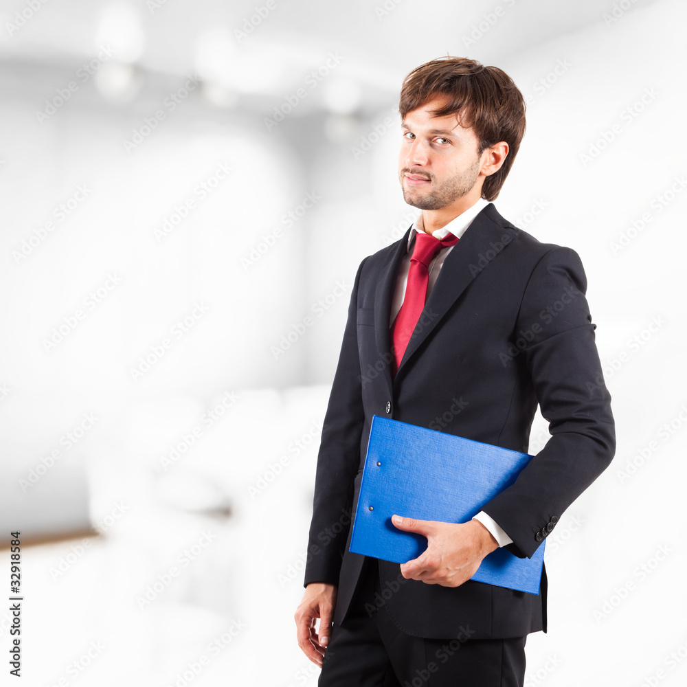 Portrait of a successful businessman with his agenda Portrait of a successful businessman with his agenda