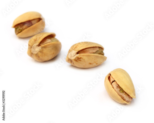 Pistachios over white background