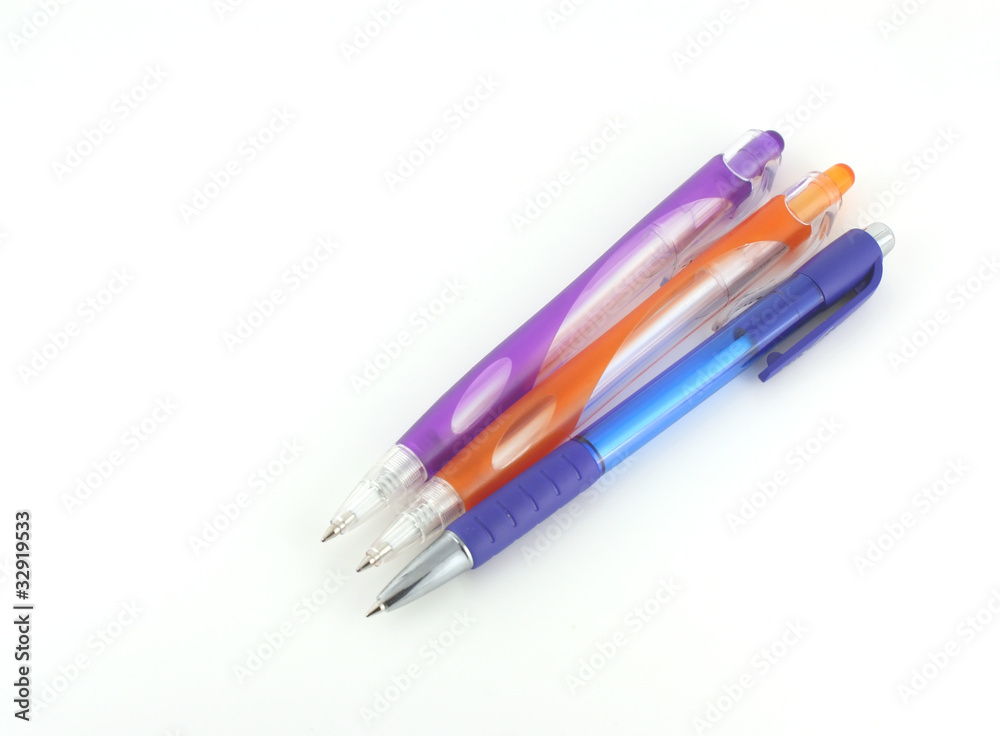 Three color pens over white