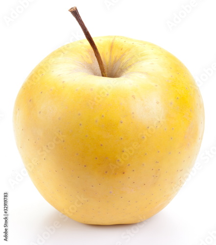 Juicy yellow apple, isolated on a white background.