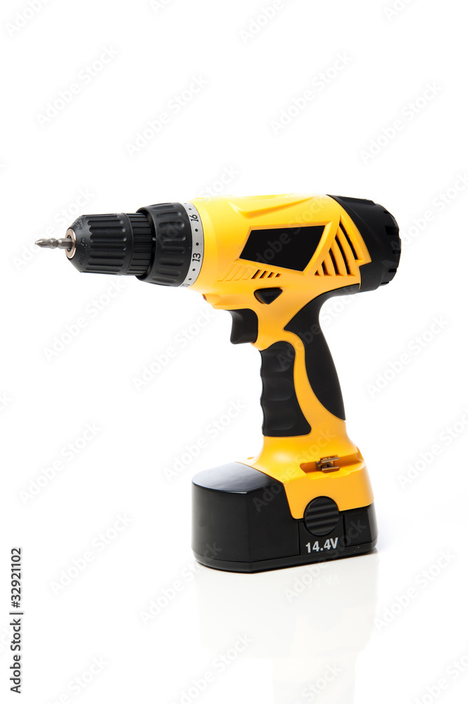 Yellow power drill isolated against white