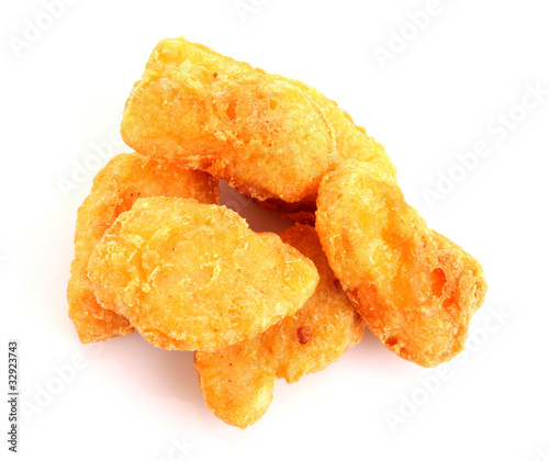 Fried chicken pieces isolated on white