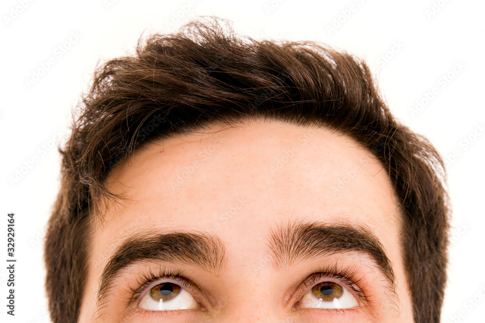 Naklejka premium Close-up of Young man looking up
