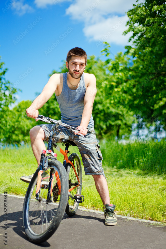 Naklejka premium Young man cyclist