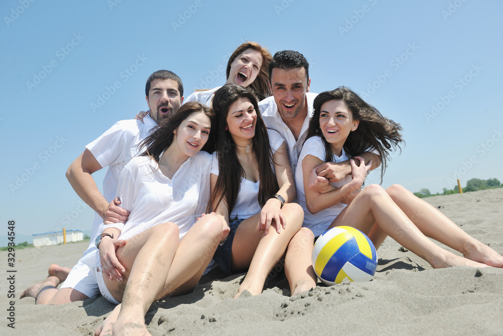 happy young people group have fun on beach happy young people group have fun on beach