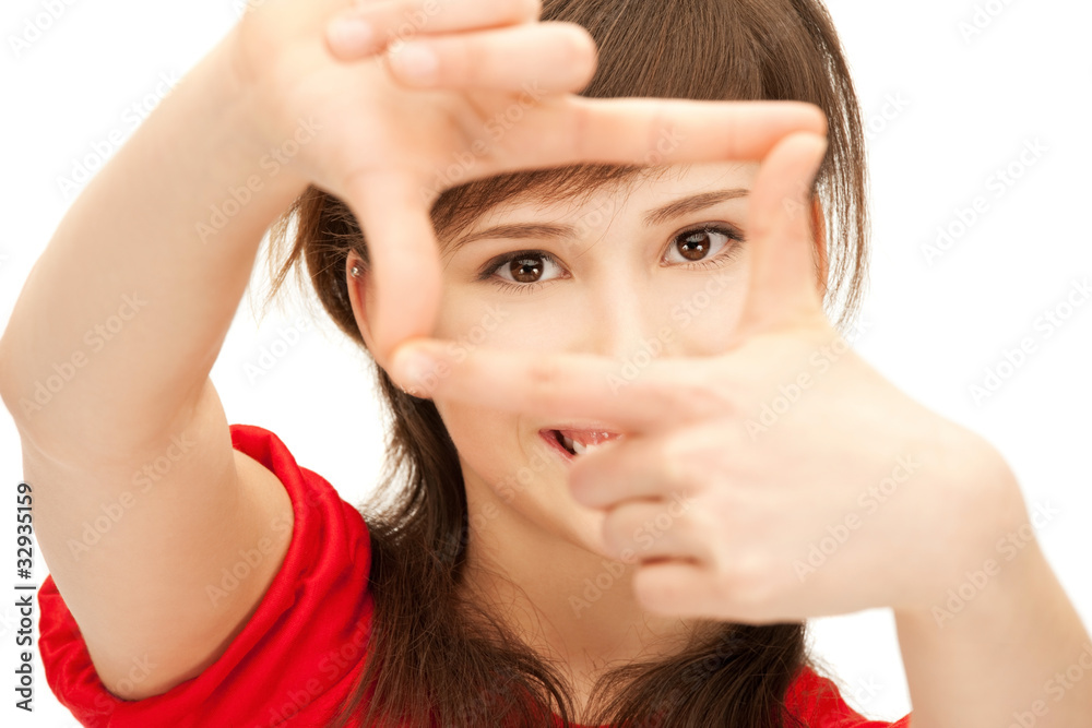 teenage girl creating a frame with fingers teenage girl creating a frame with fingers