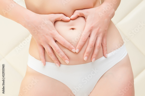 Wallpaper Mural Hands in the form of heart on a stomach of the woman Torontodigital.ca