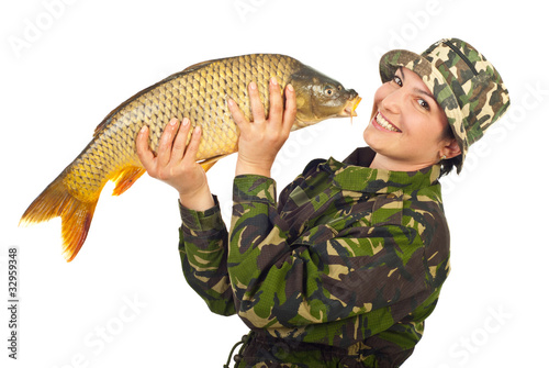 Laughing fisher woman holding big fish