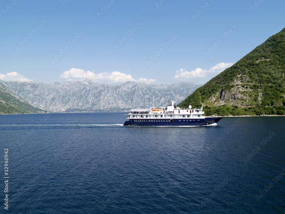 Ship sailing in bay