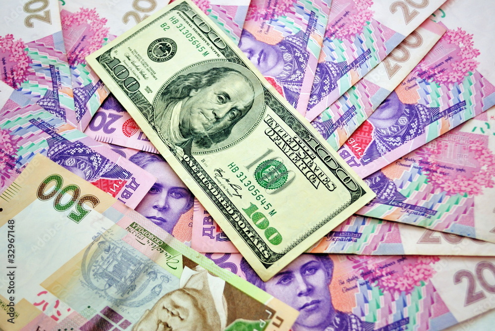 Background made of Ukrainian hryvna and american dollar Background made of Ukrainian hryvna and american dollar