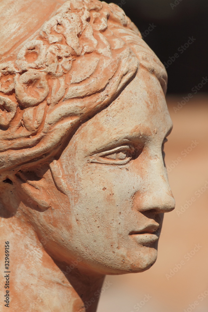 Obraz premium beautiful terracotta female face profile, Italy