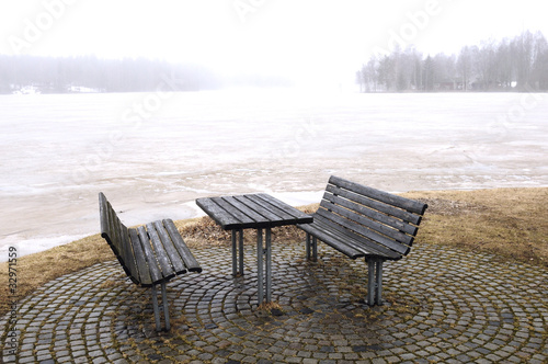 Bench in winter at the shore