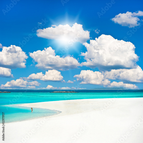 Fototapeta Naklejka Na Ścianę i Meble -  tropical sand beach over cloudy sky.