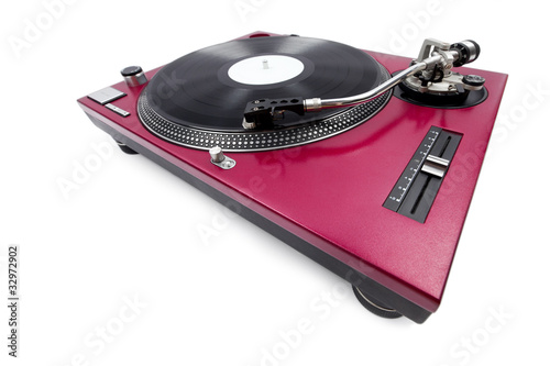A wide angle shot of a cherry red turntable from the pitch side