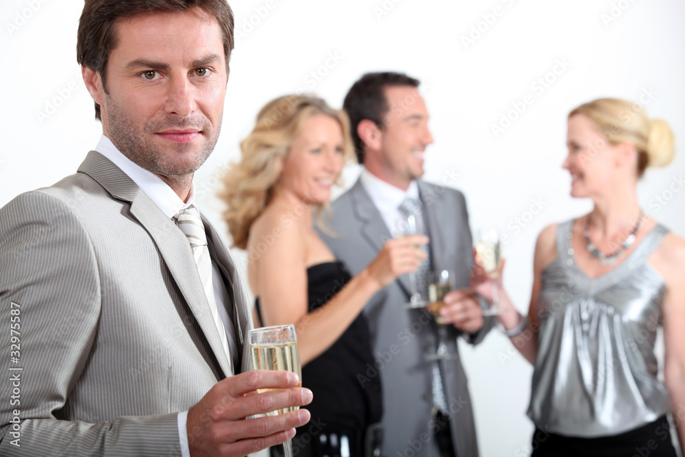 Four colleagues drinking champagne Four colleagues drinking champagne