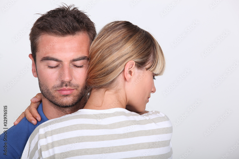 young man and woman embracing young man and woman embracing