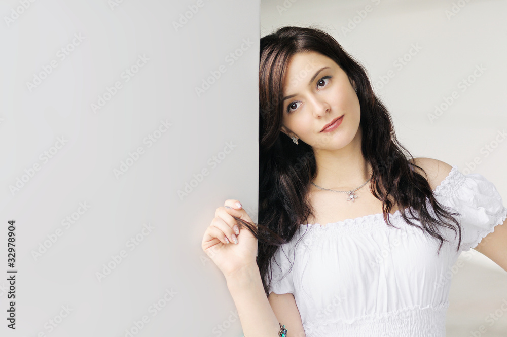 Portrait of beautiful young woman next to copy space Portrait of beautiful young woman next to copy space