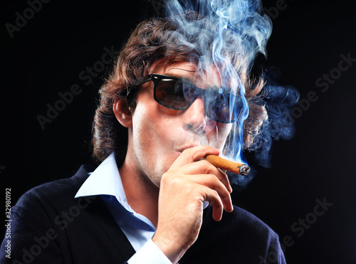 Closeup portrait of a man with cigar