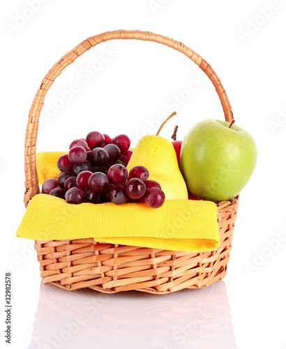 Basket with fruits isolated on white
