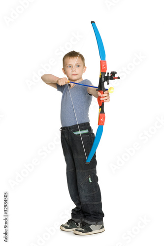 Boy shooting a bow photo