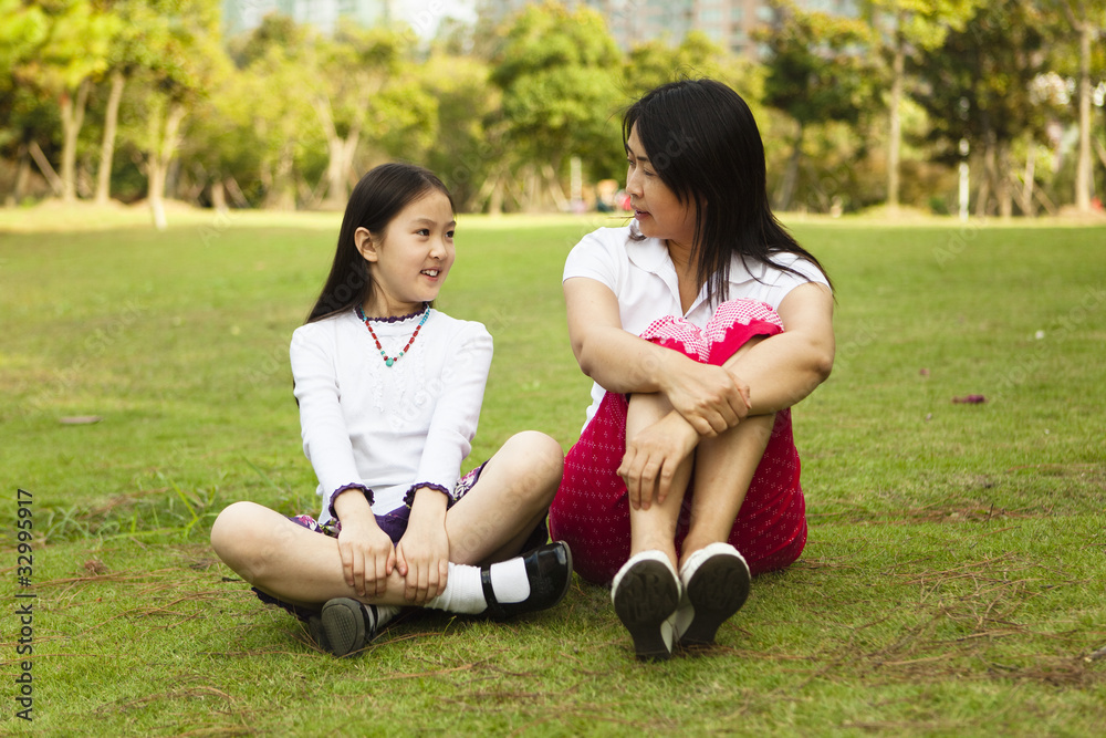 asian mother and daughter having a conversation asian mother and daughter having a conversation