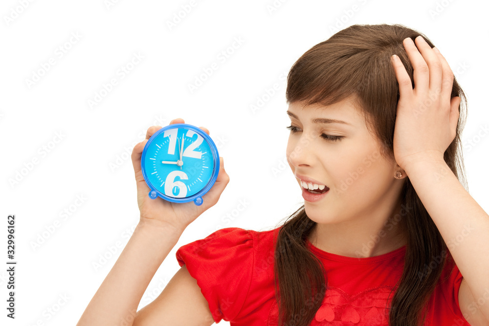 teenage girl holding alarm clock teenage girl holding alarm clock
