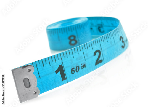 Tape measure on a white background with space for text