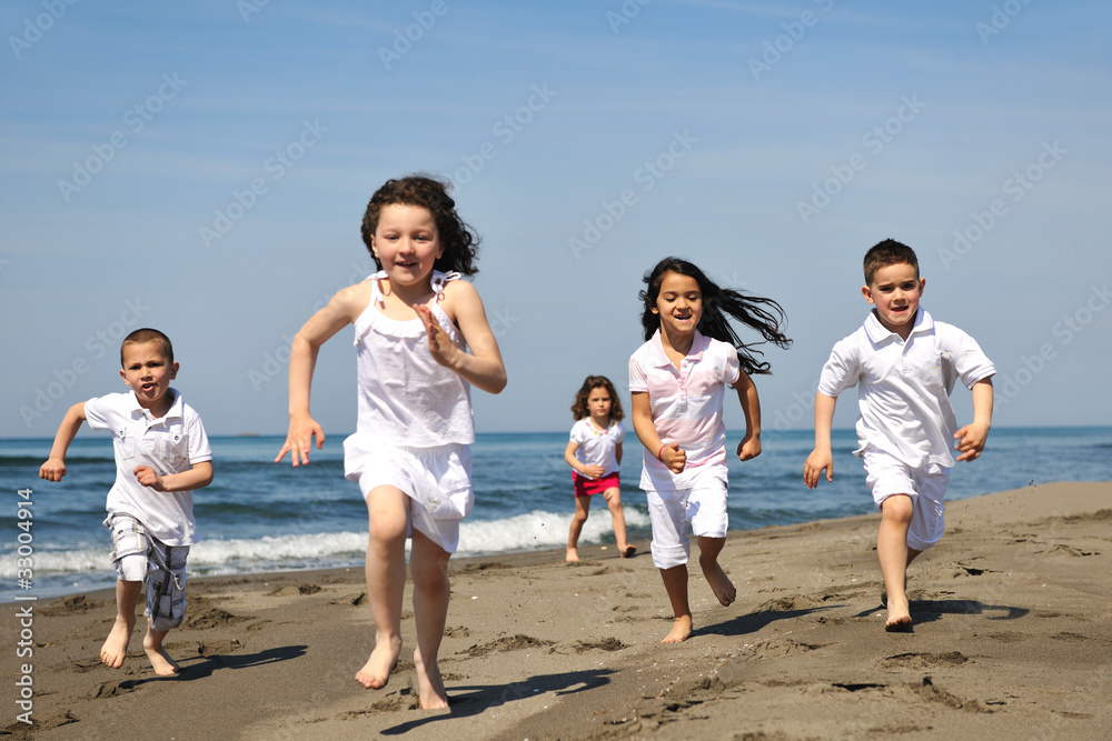 happy child group playing on beach happy child group playing on beach