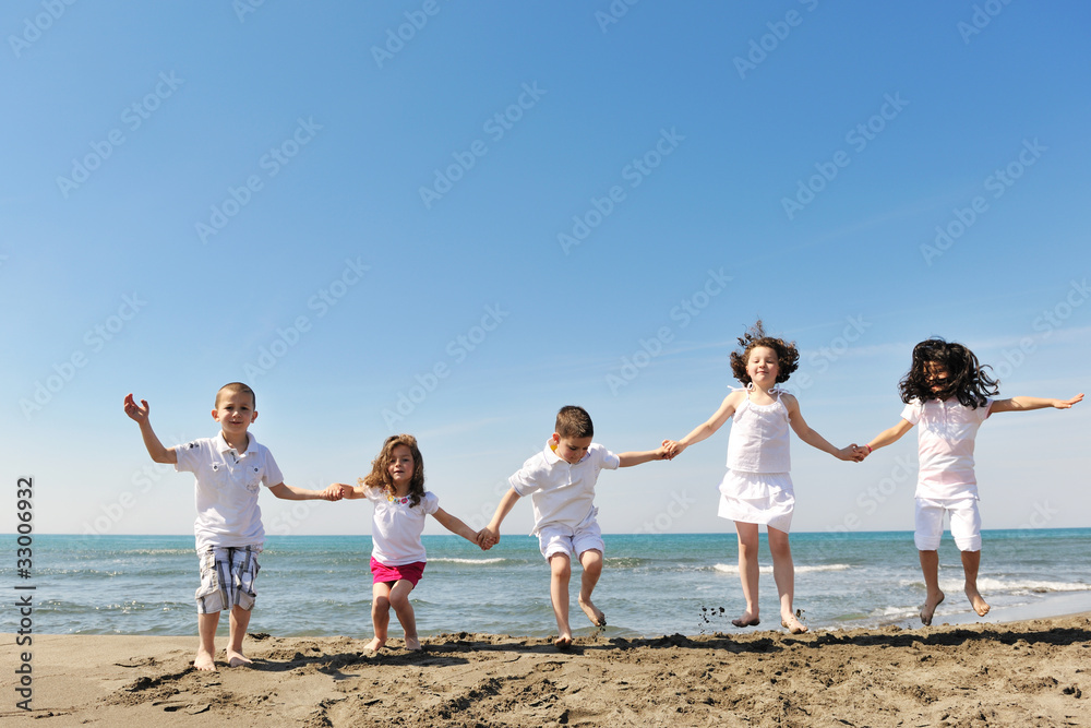 happy child group playing on beach happy child group playing on beach