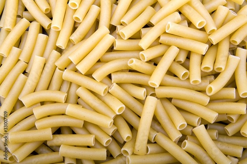 Raw ziti pasta noodles closeup macro photo
