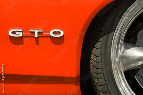 GTO badge and sports car wheel arch photo