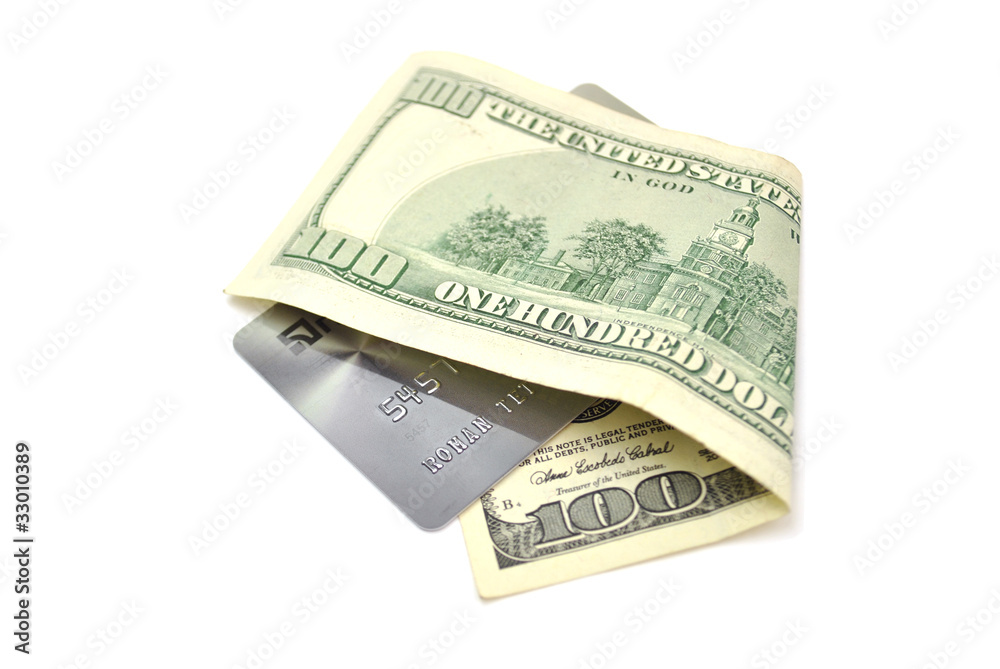 credit card wrapped in a dollar isolated on white credit card wrapped in a dollar isolated on white