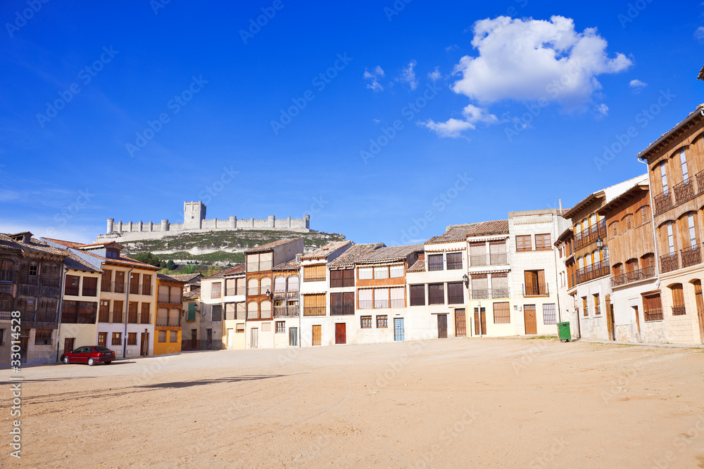 Medieval houses in Peñafiel, with the castle as background Medieval houses in Peñafiel, with the castle as background