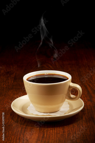 Coffee cup on wooden table © Igor Klimov