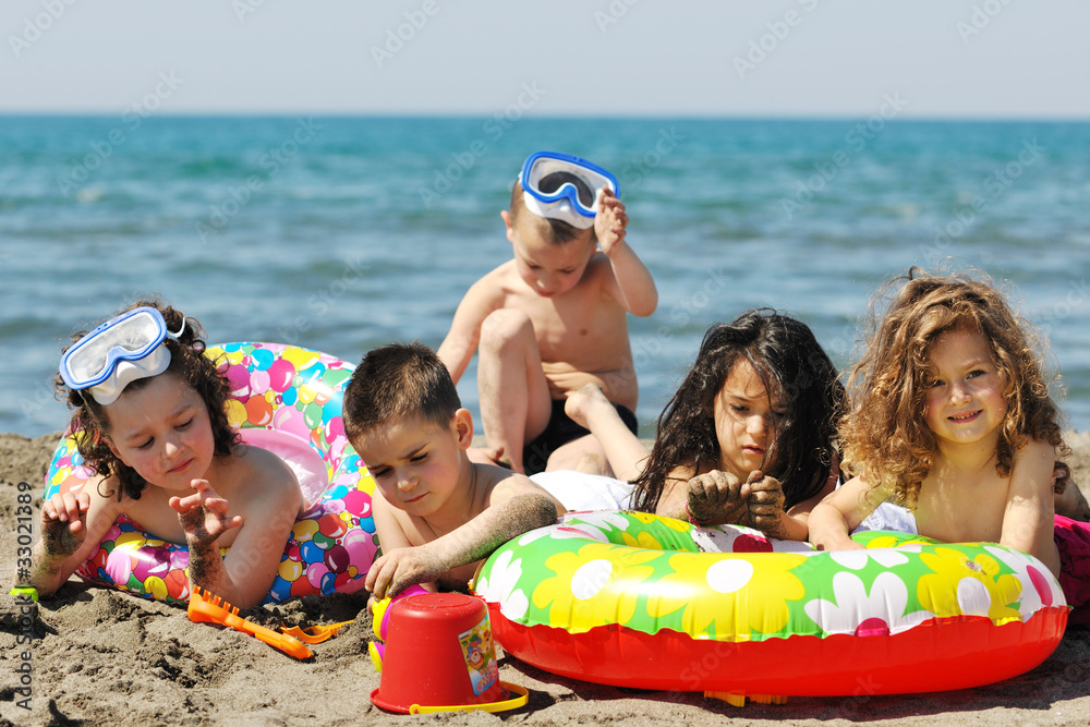 Obraz premium child group have fun and play with beach toys